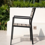 Side view of weather-resistant outdoor armchair on patio