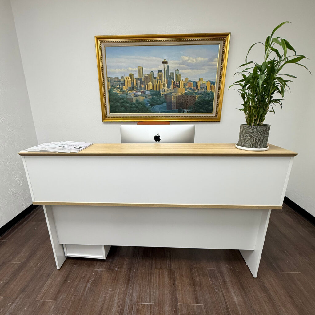 Minimalist office reception desk with an iMac