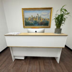 Minimalist office reception desk with an iMac