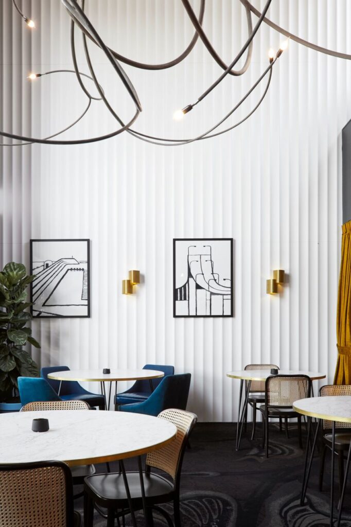 Modern restaurant dining area with round marble tables