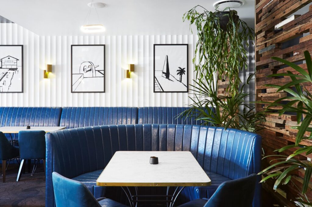 Blue upholstered booth seating in a modern restaurant interior