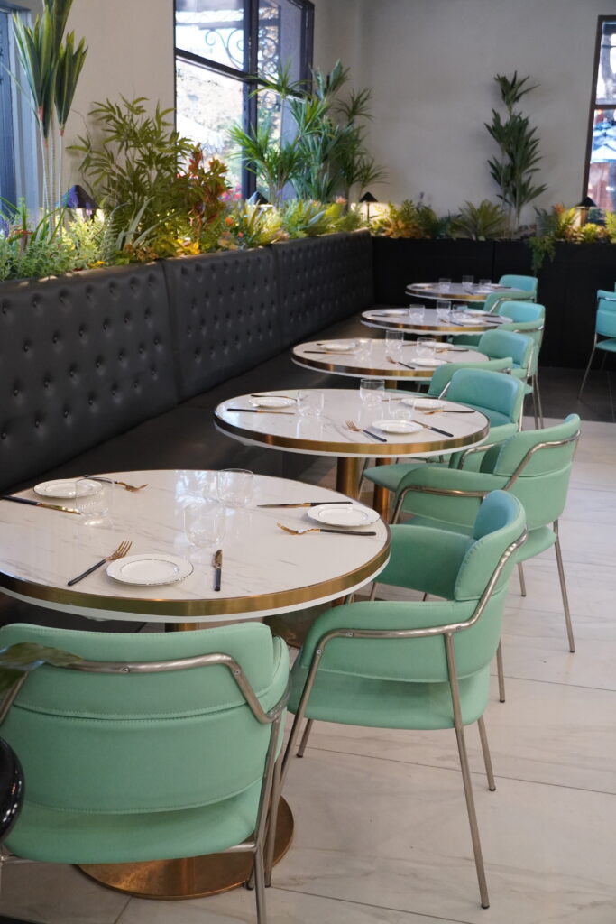 Modern restaurant interior with mint-green chairs