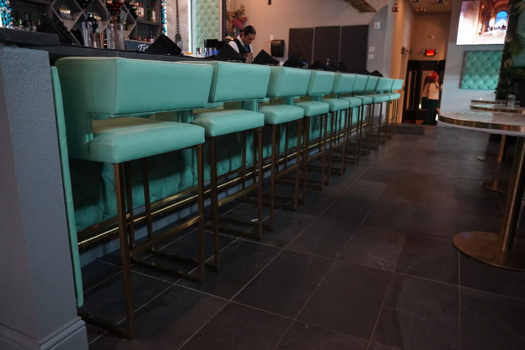 Elegant restaurant seating with turquoise chairs