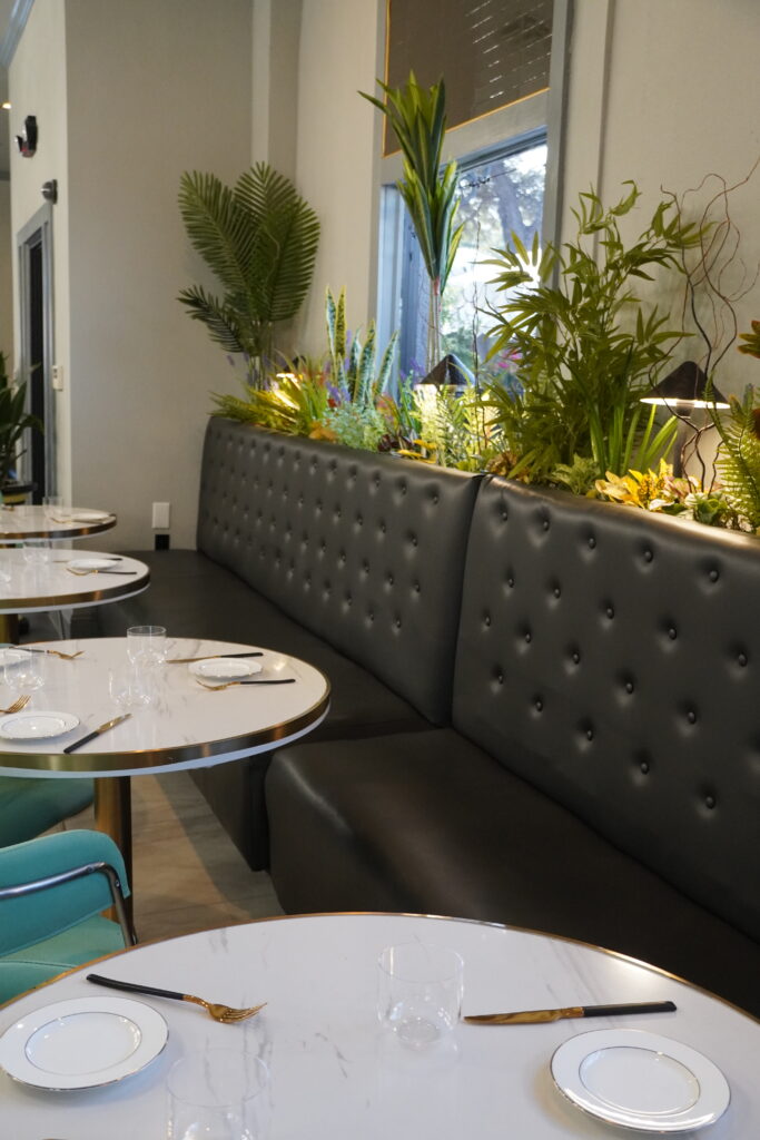 Stylish restaurant interior with black and gold seating