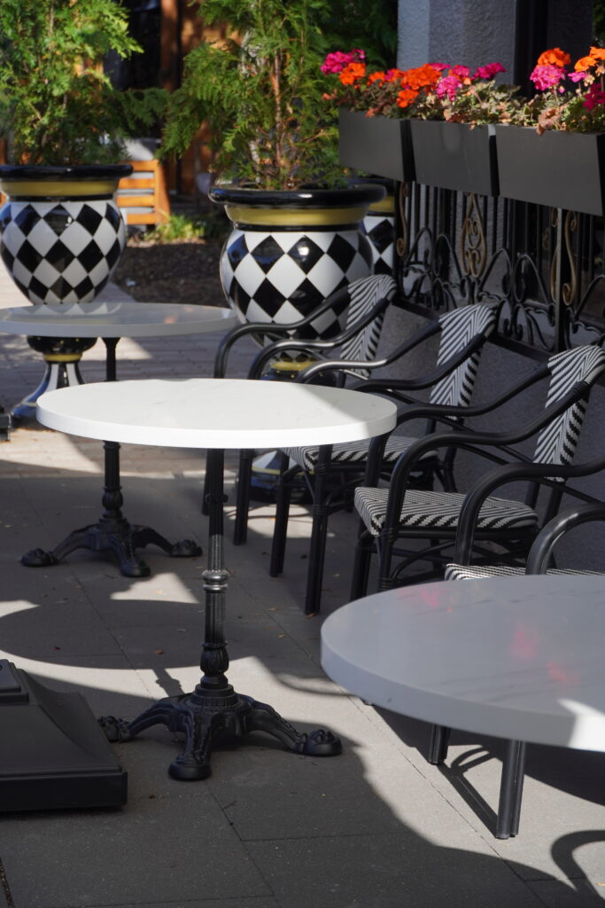 Stylish restaurant interior with teal upholstered bar stools