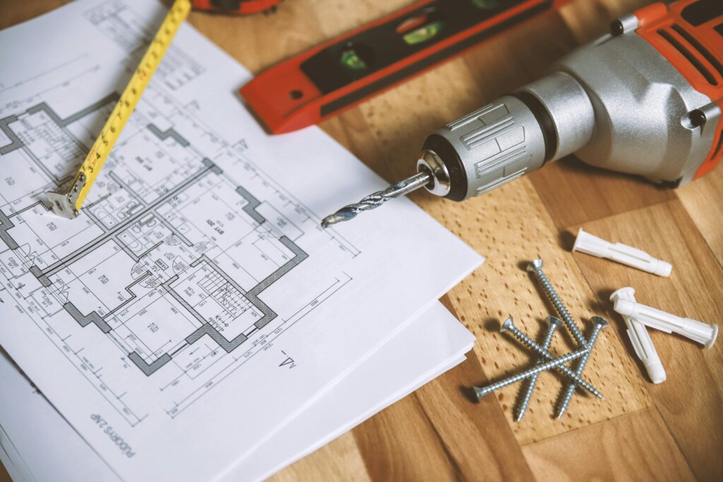 Power drill, screws, and tape measure