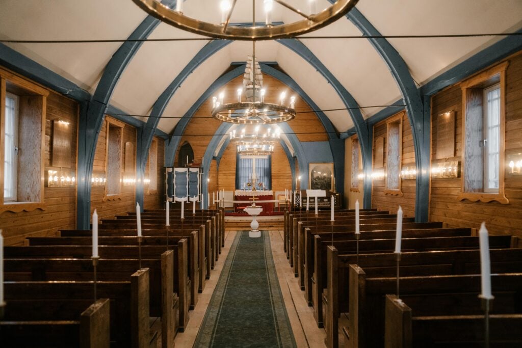 Pews with White Candles scaled