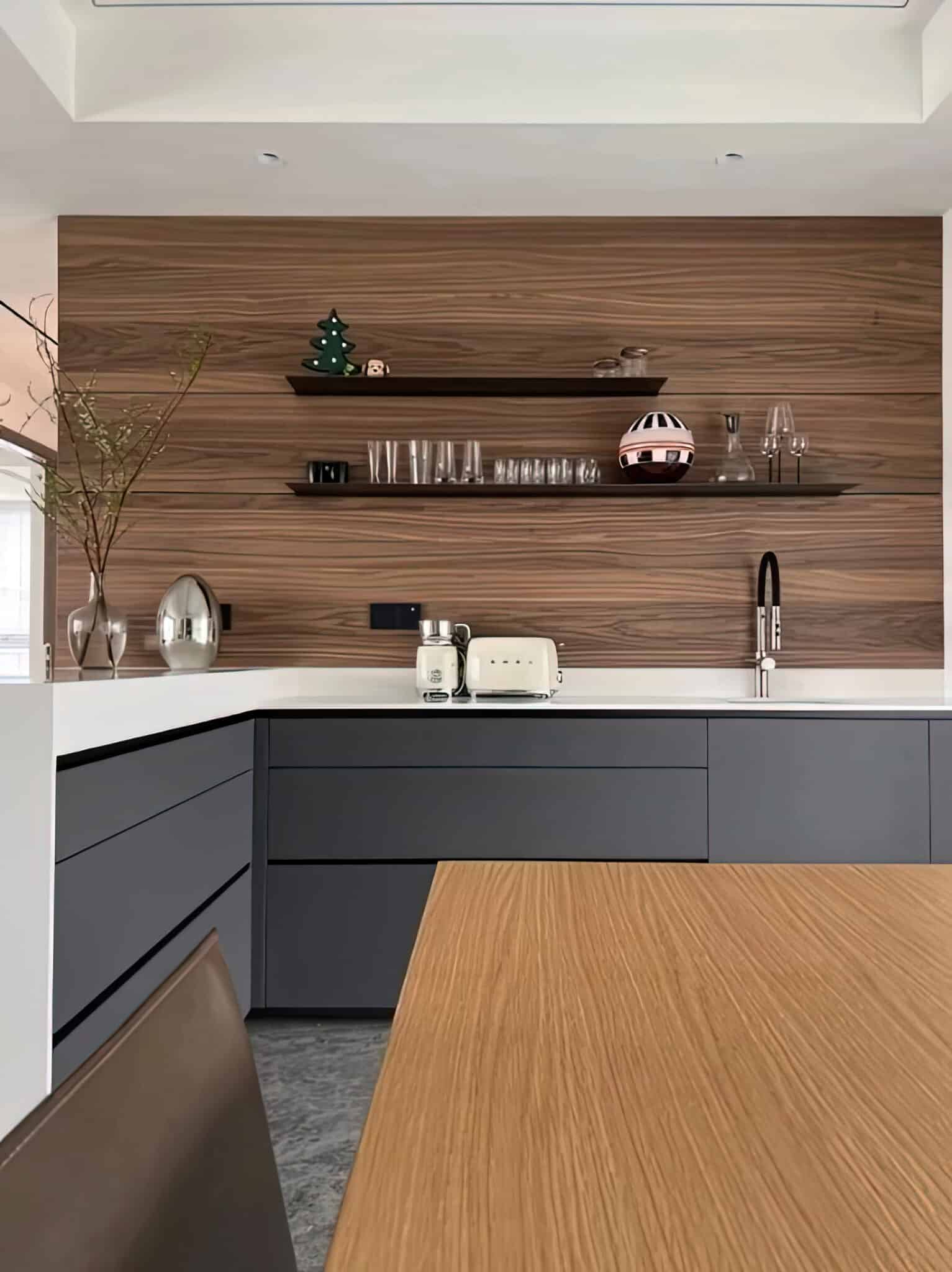 Zenith Elements Modern Kitchen Suite – Matte Slate Cabinetry with Walnut-Grain Feature Wall & Quartz Waterfall Peninsula