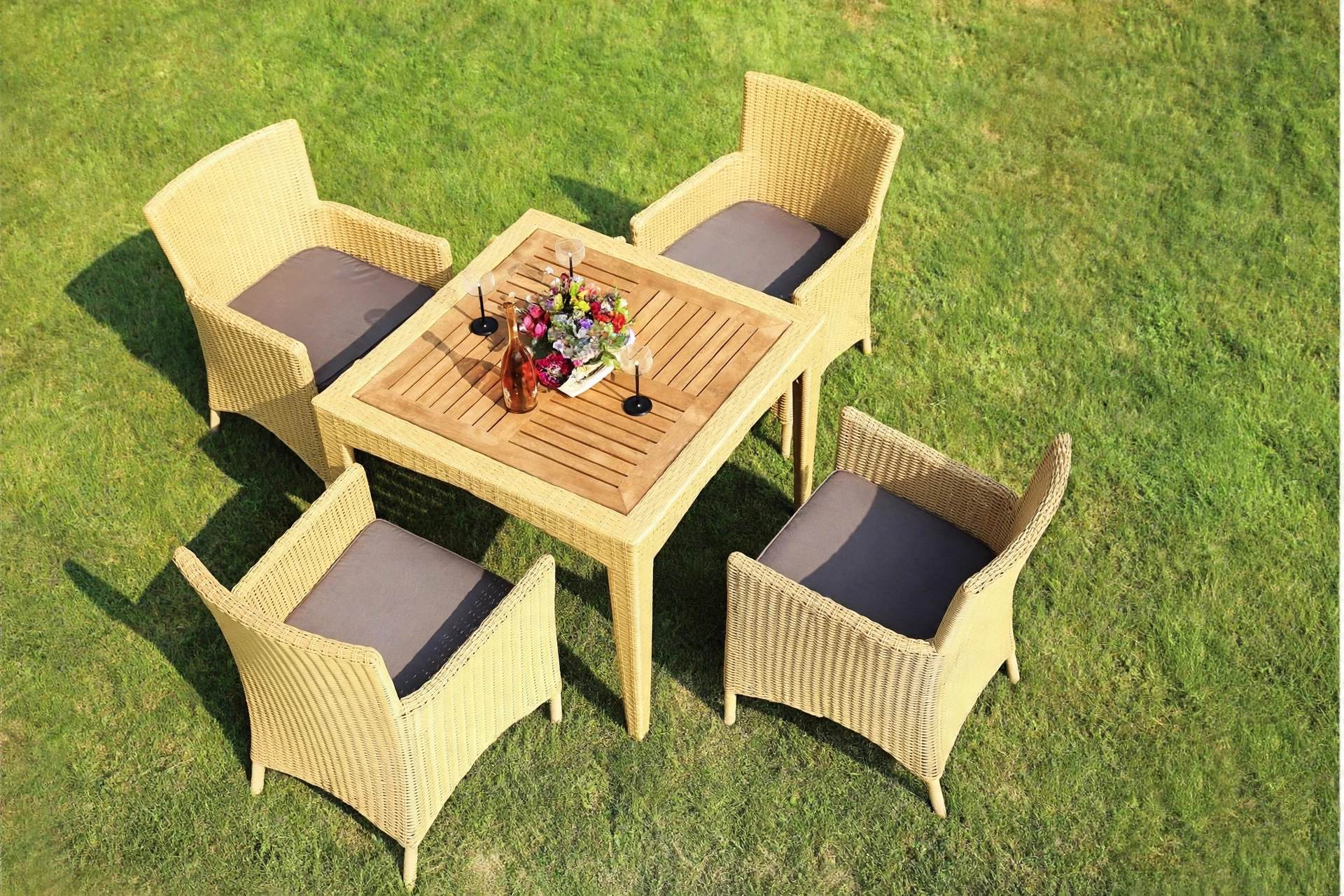 Outdoor Dining Table Set FOH-OT-8004AC on a resort lawn