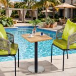 Outdoor Coffee Tables FOH-OT-CF2063D beside a resort pool
